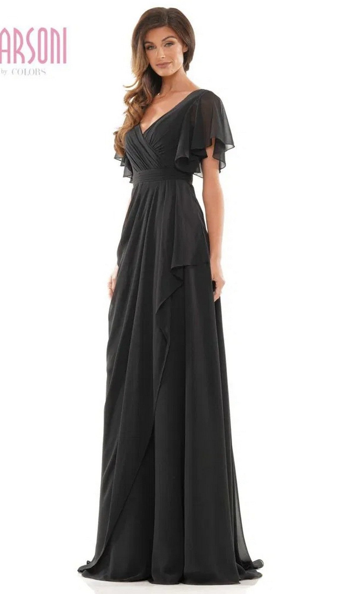 A woman models the Marsoni M320, a long formal black dress with flutter sleeves, V-neckline, and elegant A-line skirt, standing against a plain white background.